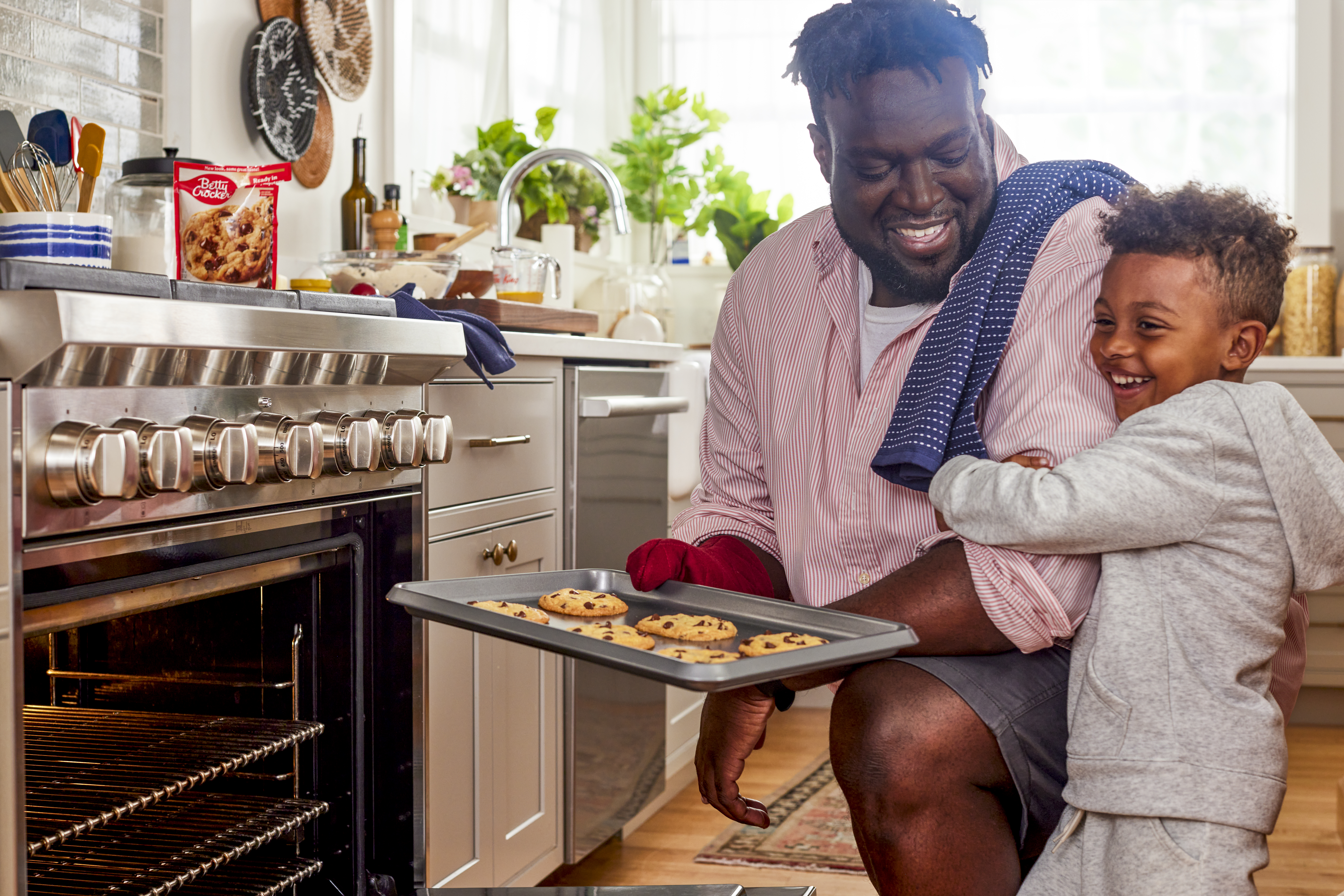 General Mills is focused on improving food security in communities of color -Father and son enjoying Betty Crocker cookies